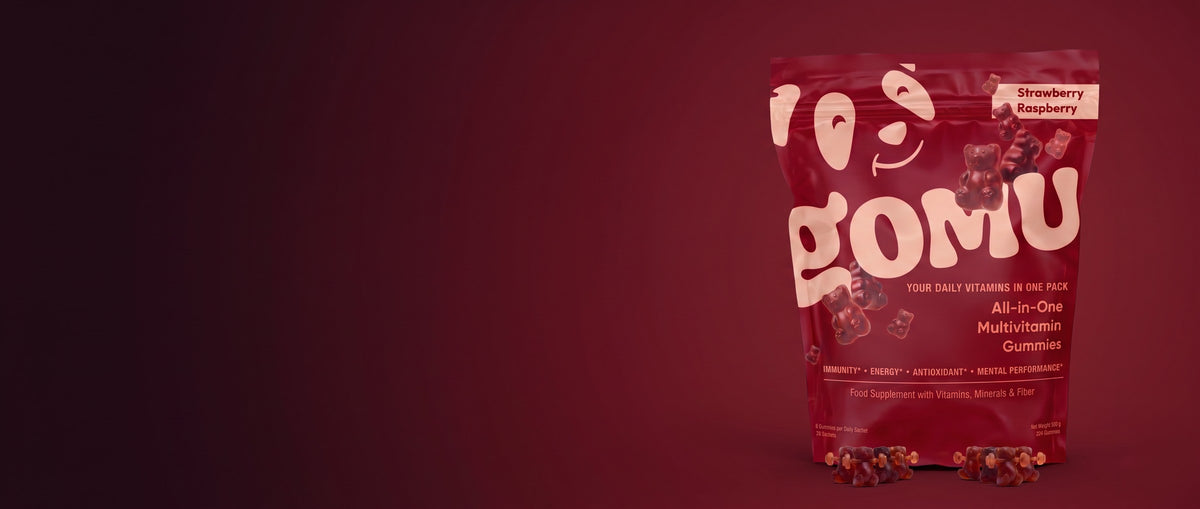 GOMU pouch with gummy bears on burgundy background