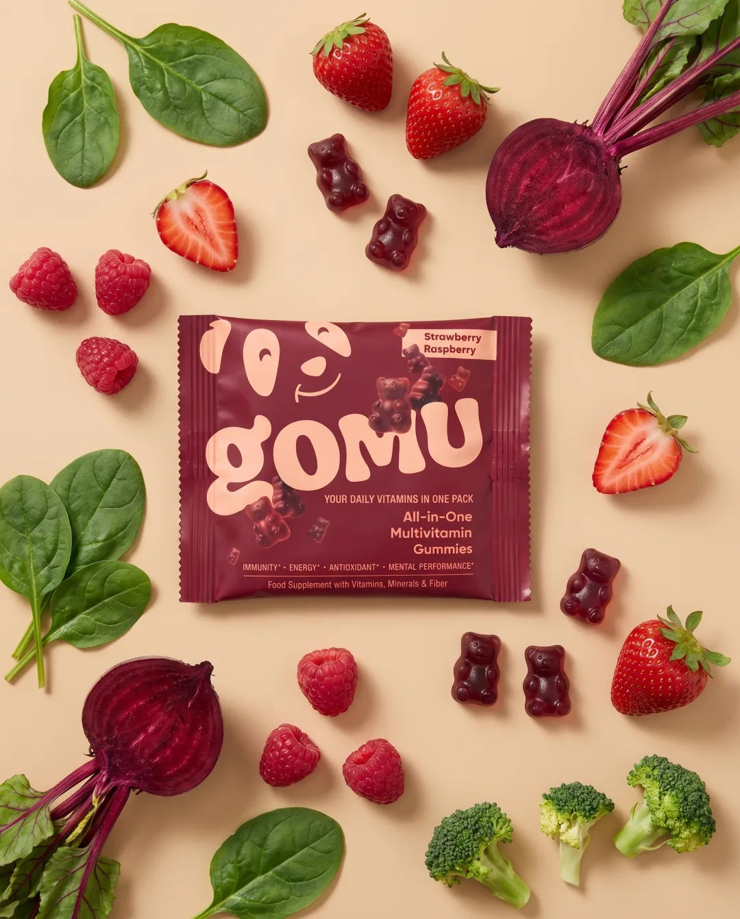 GOMU gummies surrounded by fresh fruit and vegetables