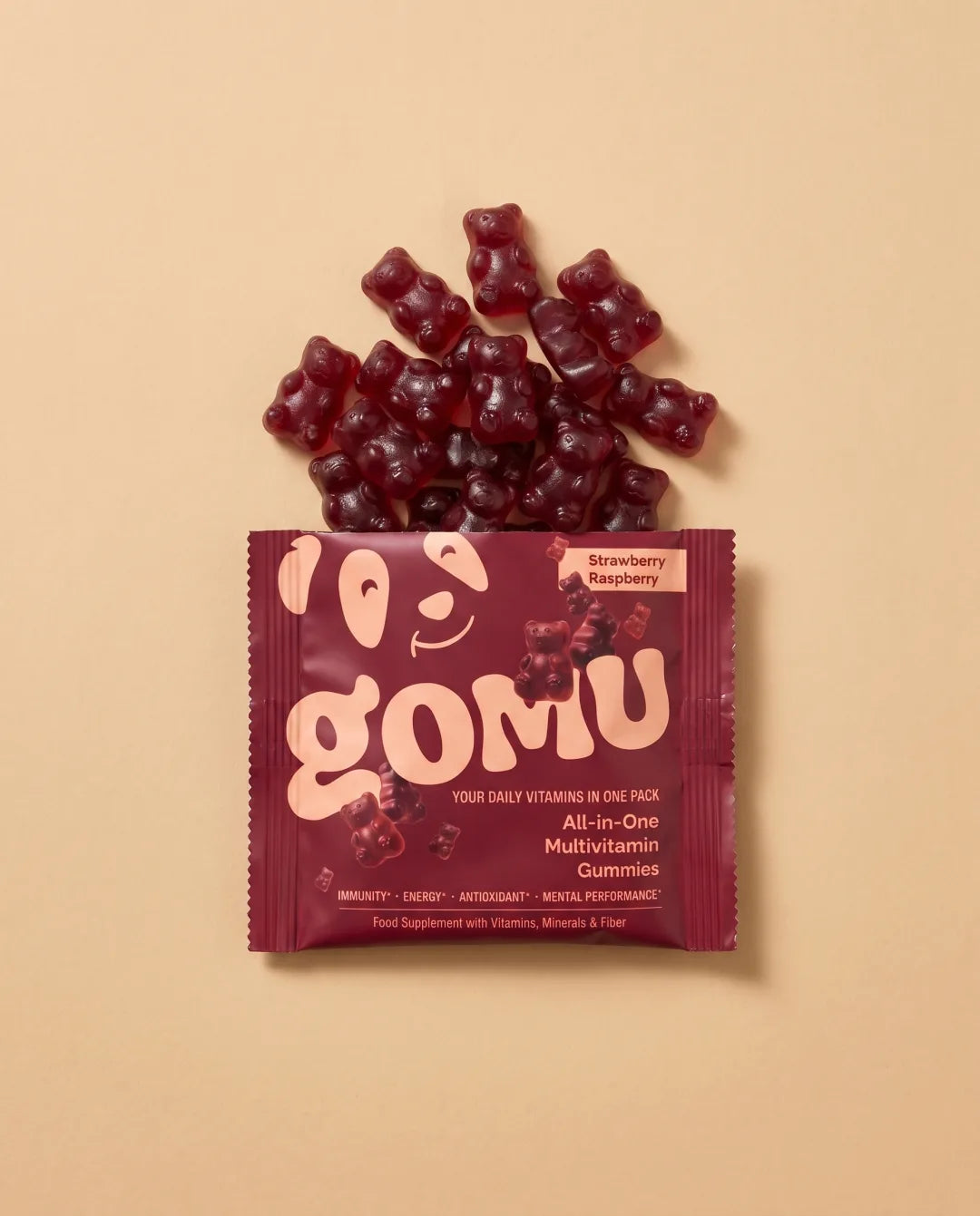 An opened GOMU daily sachet with gummies